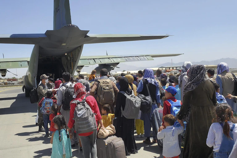 Afghan refugees preparing to board a South Korean flight in Kabul.