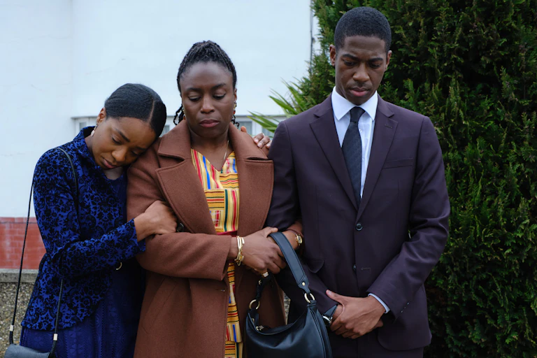 Sharlene Whyte as Doreen Lawrence,Jorden Myrie as Stuart Lawrence and Yasmin Mwanza as Georgina Lawrence