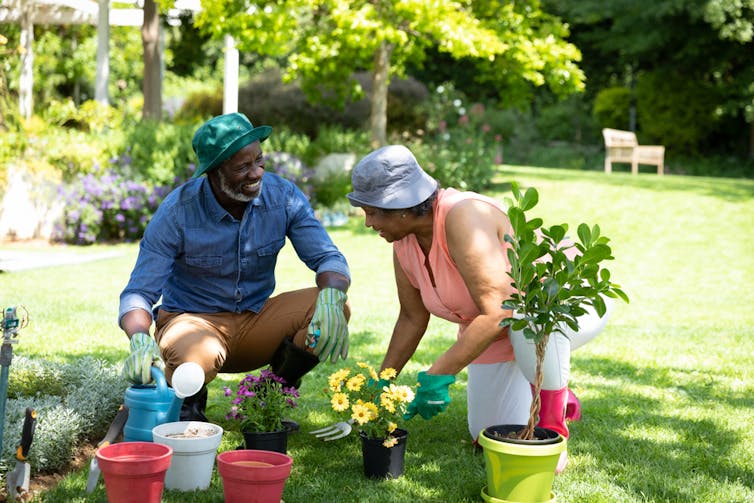 A couple gardening together