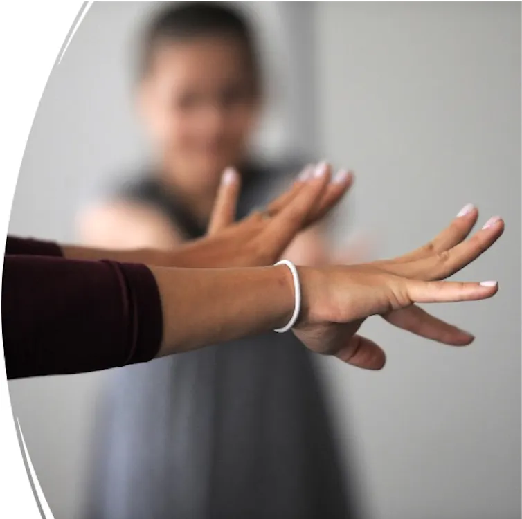 Neuroscientist Lana Ruvolo Grasser does a tension-and-release exercise with study participants.