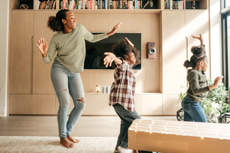 Mother and kids dancing