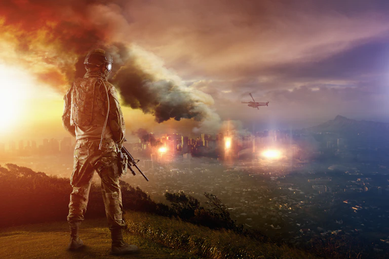 A soldier with a rifle overlooks plumes of smoke.