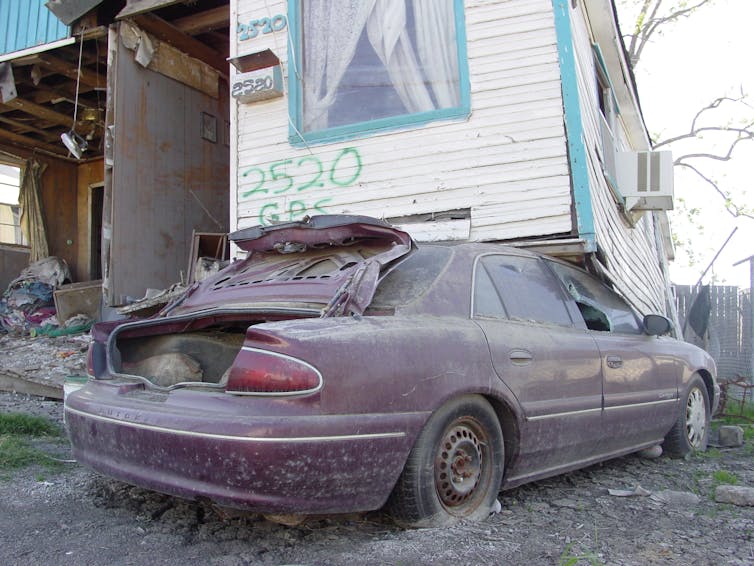 a damaged car and building