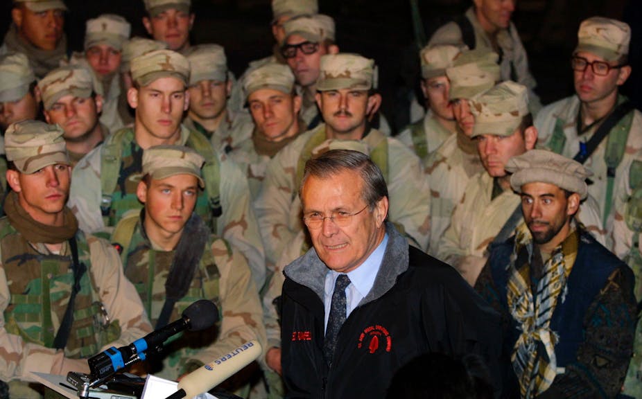 U.S. Secretary of Defense Donald Rumsfeld (C) addresses members of the 10th Mountain Division December 16, 2003 at Baghram Air Base in Afghanistan.