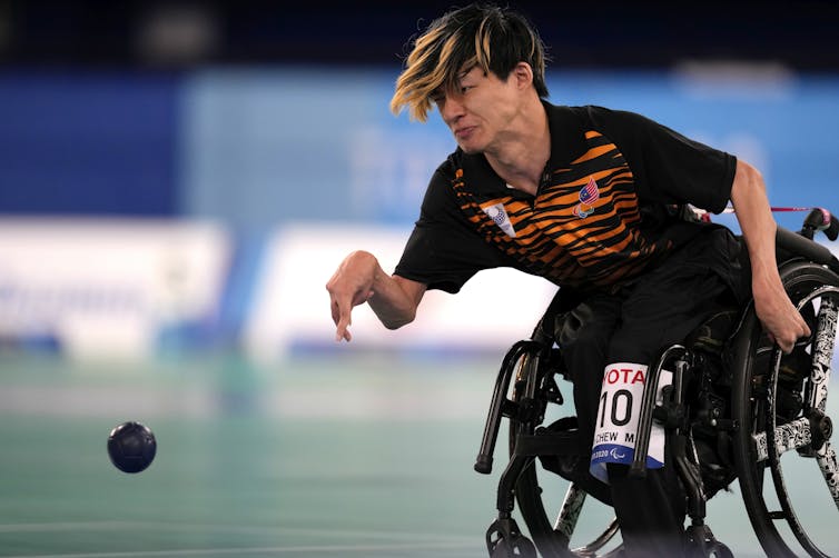 Malaysia’s Chew Wei Lun plays a shot during a gold medal Boccia match at the Tokyo Paralympic Games. Boccia is only one of three summer Paralympic sports where athletes can compete while using a powerchair. (AP Photo/Shuji Kajiyama)