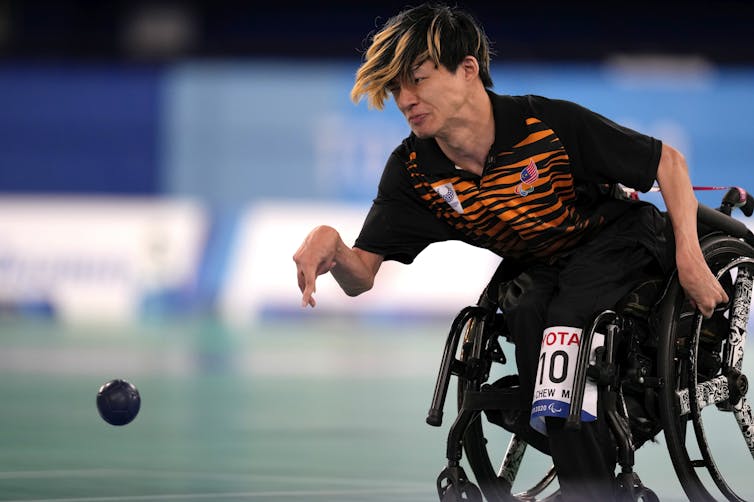 Malaysia鈥檚 Chew Wei Lun plays a shot during a gold medal Boccia match at the Tokyo Paralympic Games. Boccia is only one of three summer Paralympic sports where athletes can compete while using a powerchair. (AP Photo/Shuji Kajiyama)