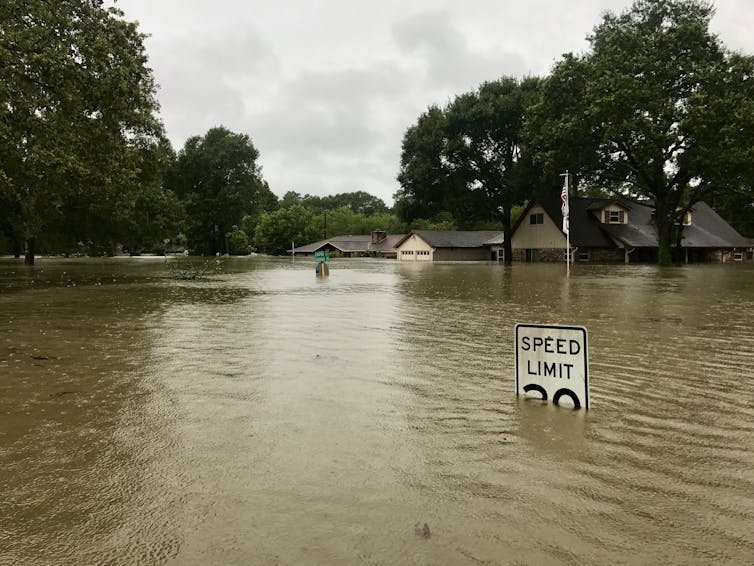 A house is submerged in floodwaters.