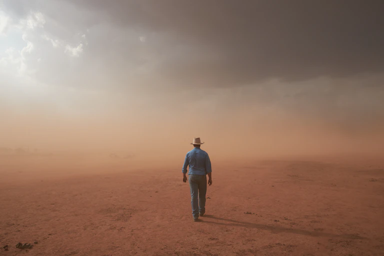 A dust storm engulfs a farm in Forbes, NSW. This image won the National Photographic Portrait Prize for 2021.