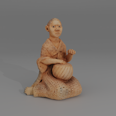 Clay figurine of seated woman with a drum