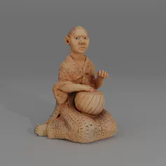 Clay figurine of seated woman with a drum