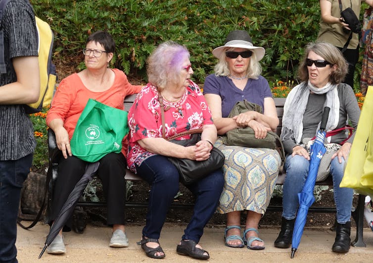 Women sitting on a bench.