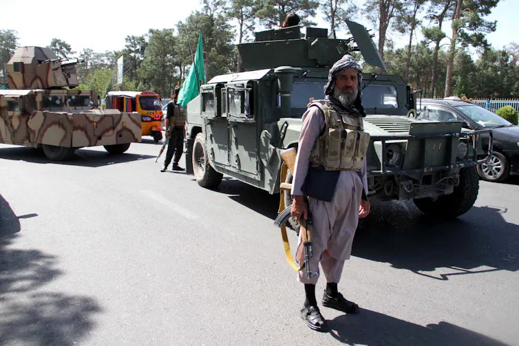 Anti-Taliban fighters and military equipment in the city of Herat, before the Taliban took the city.