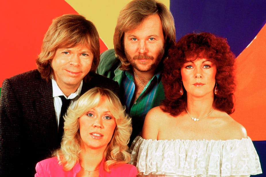 ABBA in front of colourful background