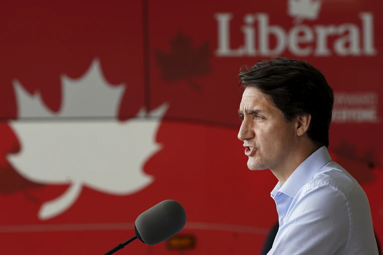 Justin Trudeau speaks into a microphone