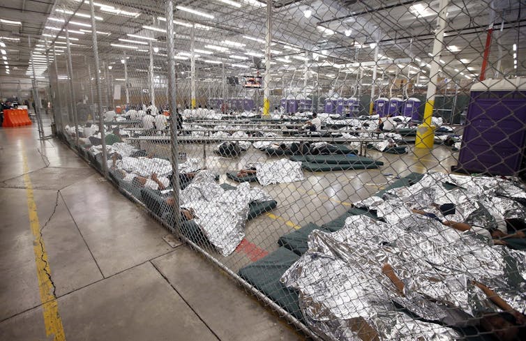 Detainees in a holding cell at the US-Mexico border.
