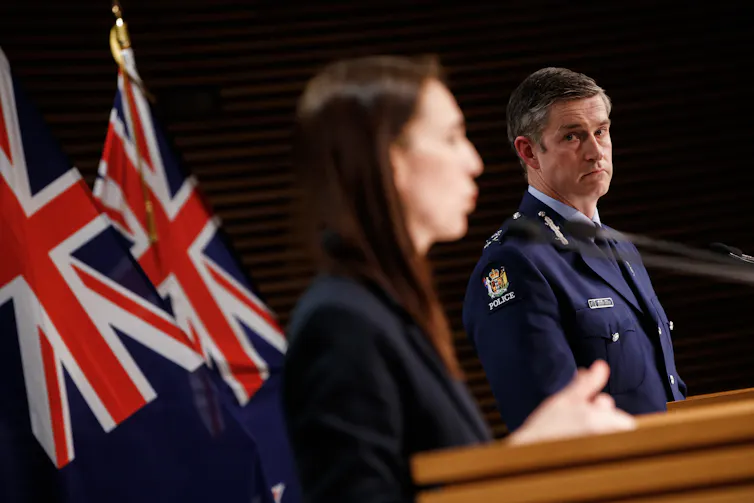 Police Commissioner Andrew Coster and Prime Minister Jacinda Ardern at lecterns