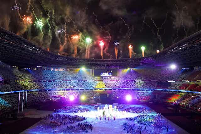Fireworks and bright lights colour Tokyo's stadium during the closing ceremony of the Tokyo 2020 Games