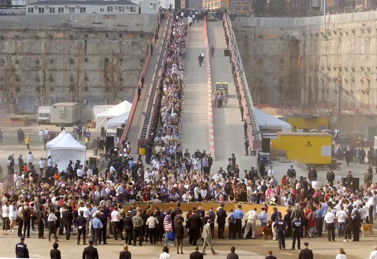 A crowd gathers at the bottom of a ramp on the site of the 9/11 terror attacks on the World Trade Center in New York.