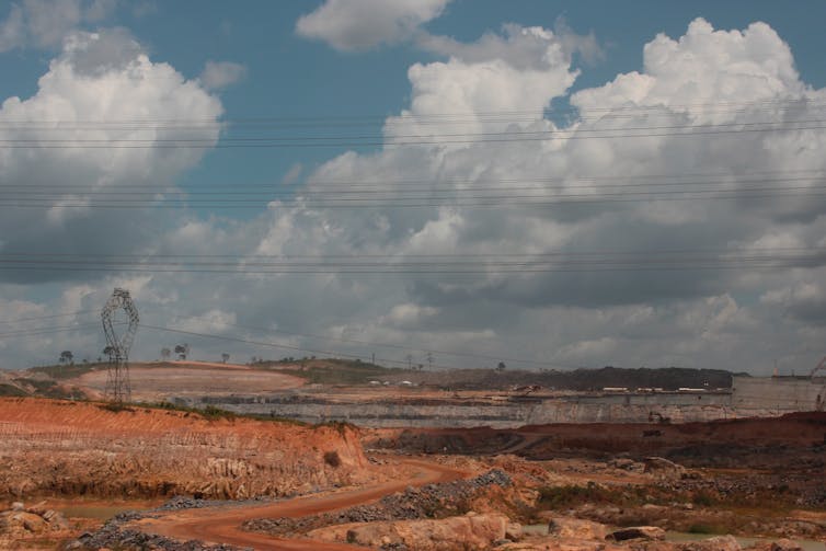 Deforested land under a cloudy sky