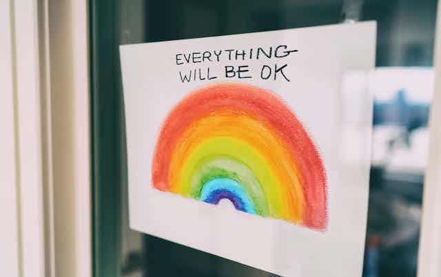 Rainbow sign in window saying 'everything will be ok'