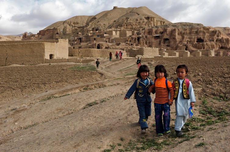 Children make their way to school from their village in the hills of Bamyan province