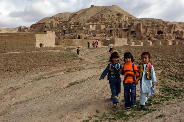 Children make their way to school from their village in the hills of Bamyan province