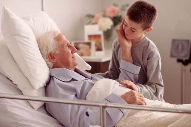A grandchild and grandfather in a hospital setting