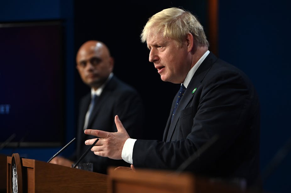 Boris Johnson unveiling his healthcare levy flanked by Sajid Javid