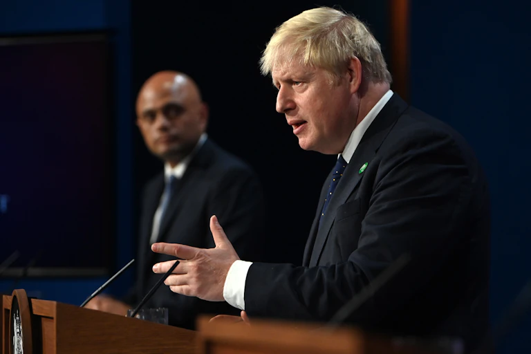 Boris Johnson unveiling his healthcare levy flanked by Sajid Javid