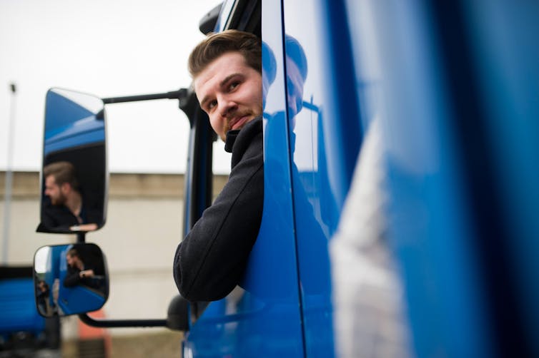 Social Care Tax Rise Is Austerity By Another Name – Economist Q&Amp;A 42 Lorry Driver Looking Out Of His Window And Reversing