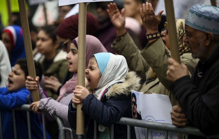 Demonstrators take part in a protest in Times Square, New York, against growing Islamophobia.