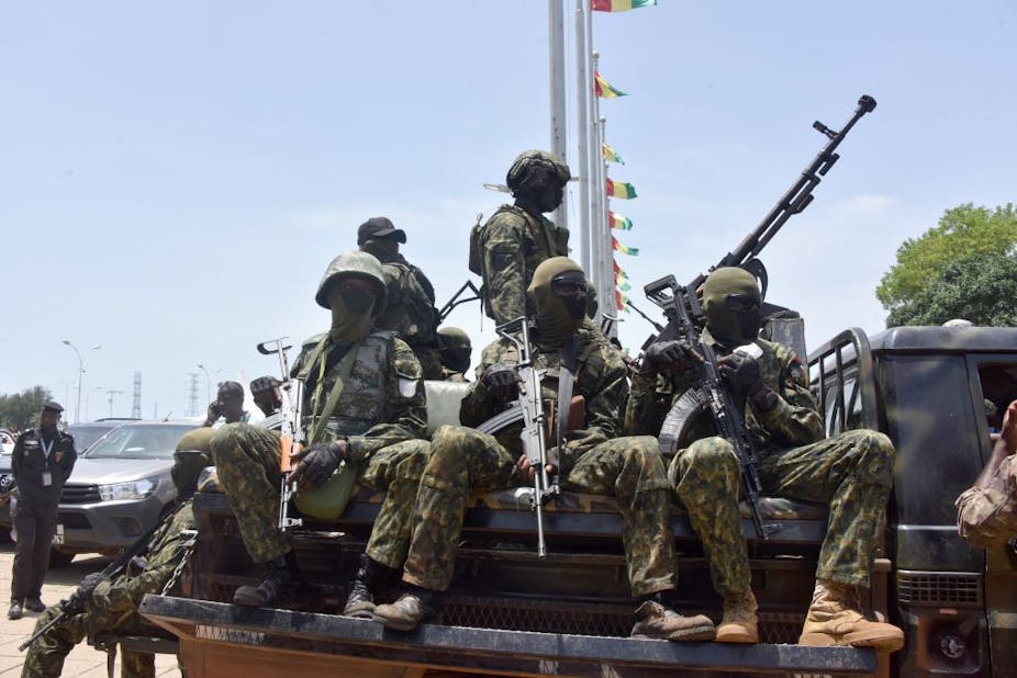 Members of Guinea's special forces atop a pick-up