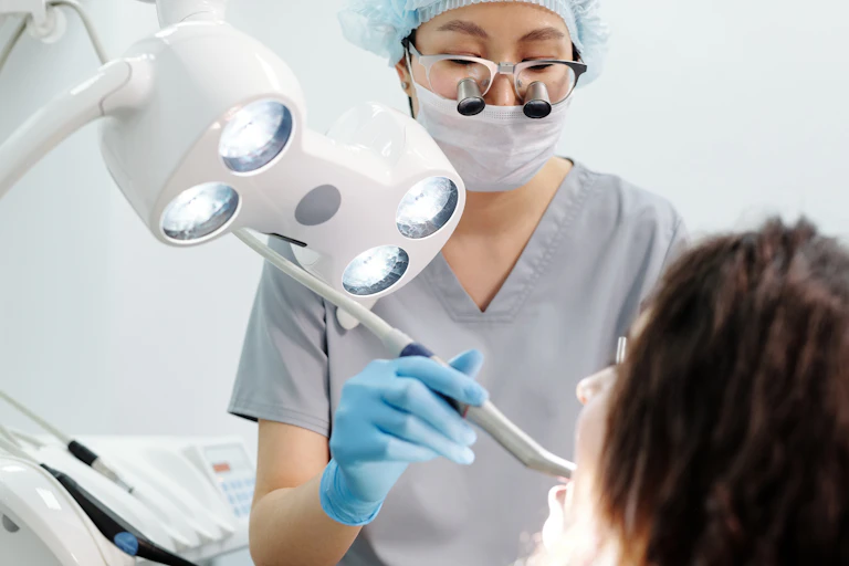A woman dentist with a patient