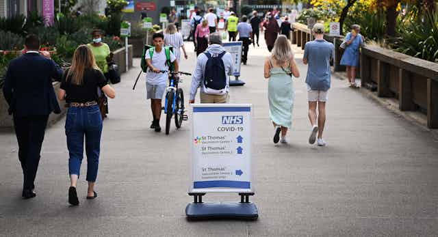 People walking outside of a London hospital