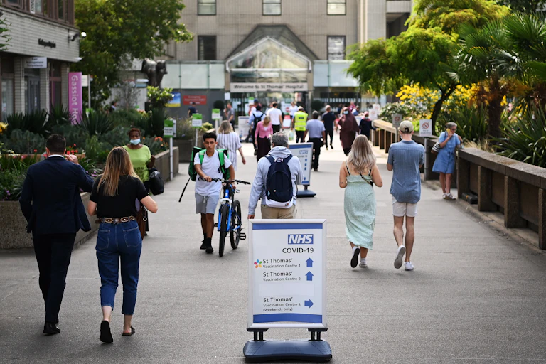 People walking outside of a London hospital