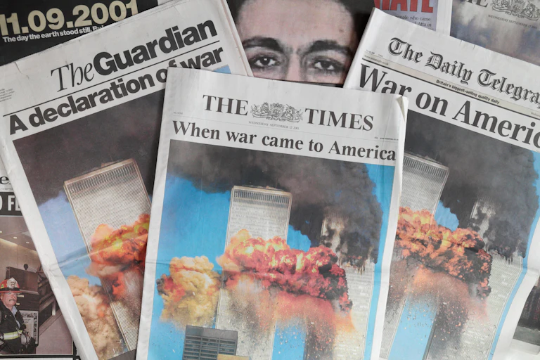 Front pages of British newspapers the day after 9/11, all with photos of the exploding World Trade Centre.