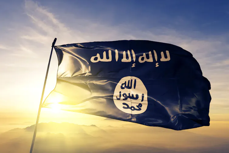 IS flag waving against a sunny sky
