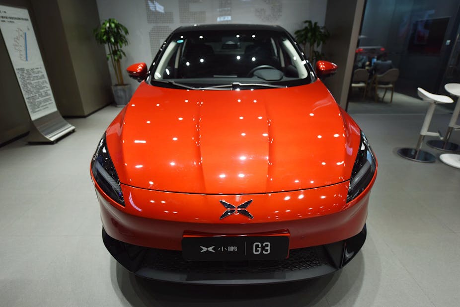 A red Xpeng G3 in a car showroom in Guangzhoou