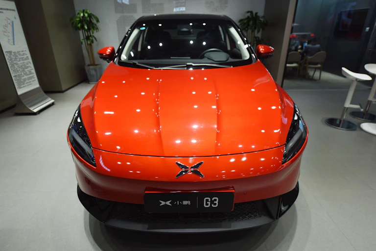 A red Xpeng G3 in a car showroom in Guangzhoou