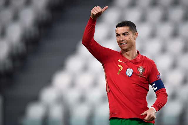 Cristiano Ronaldo gives a thumbs up during a Portgual match