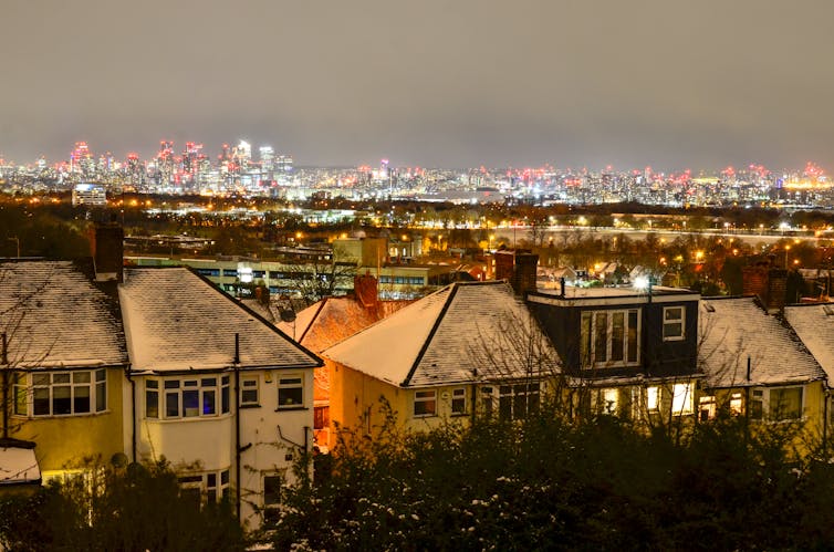 A London skyline with suburbs in the foreground and city in the background.