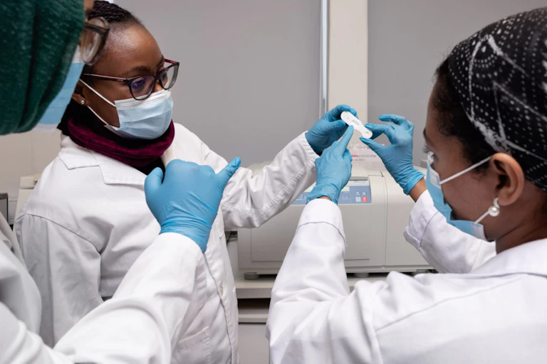 scientist in a lab looking a test