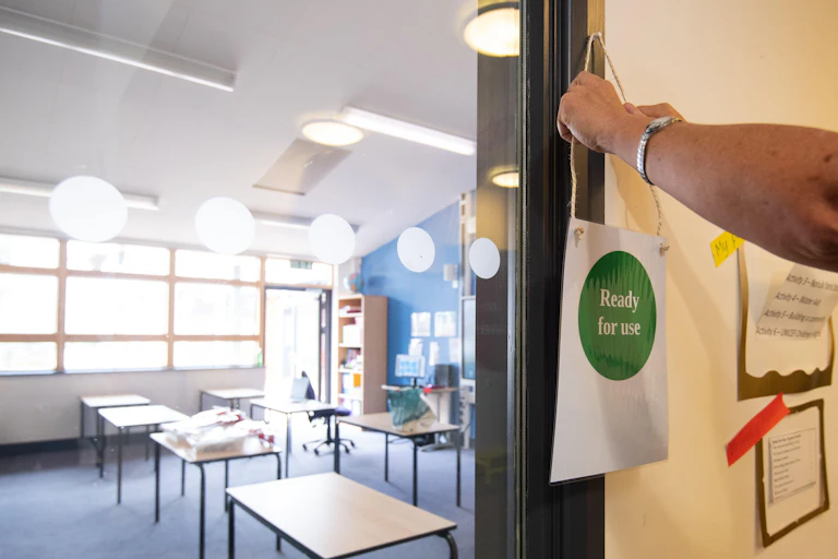 A sign is placed outside a disinfected classroom at Queen's Hill Primary School in Costessey near Norwich, as they prepare to reopen