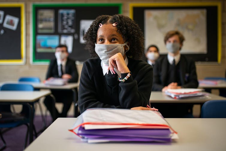 Year 11 students wear facemasks in class
