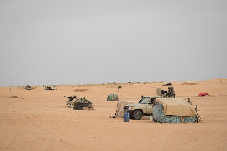 Mauritanian soldiers stand guard in the southeast of Mauritania near the border with Mali. 
