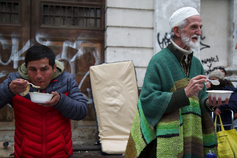 Chilean Muslims and people from other religious communities eat a meal at the weekly soup kitchen in Santiago, Chile.