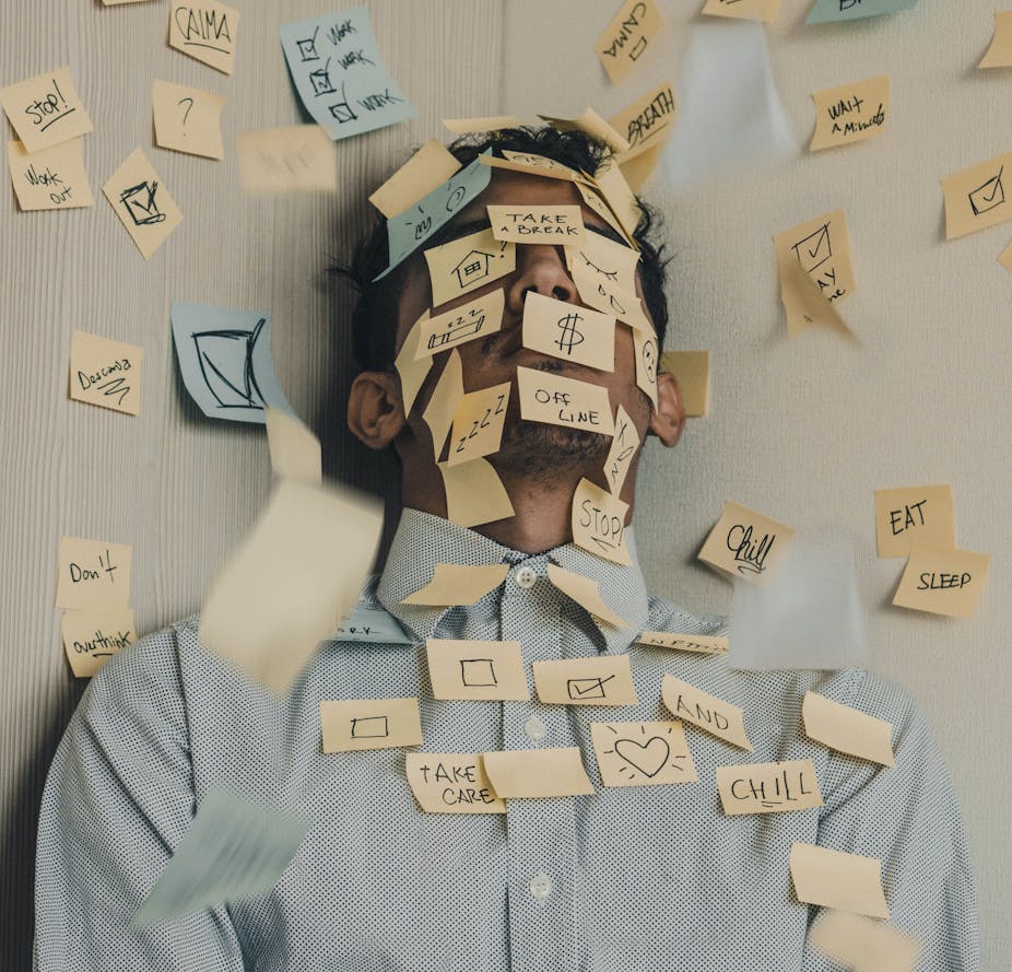 Man covered in Post-It notes