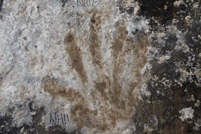 Ancient hand print in rock