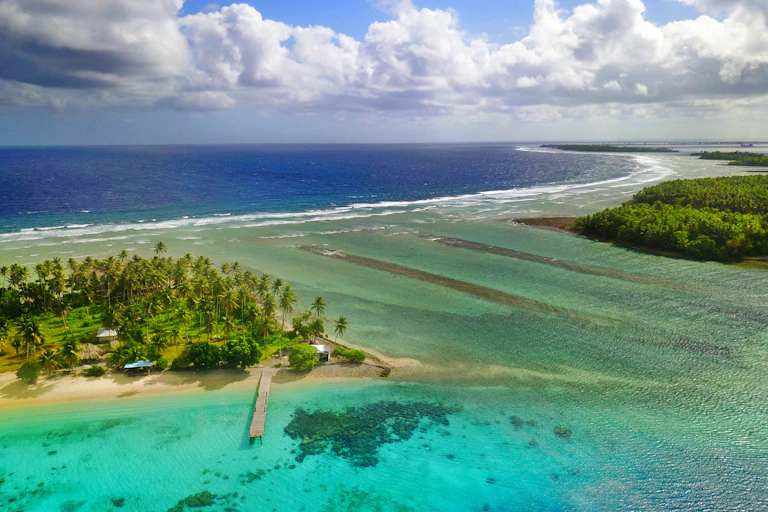 A view of small atoll islands separated by shallow water