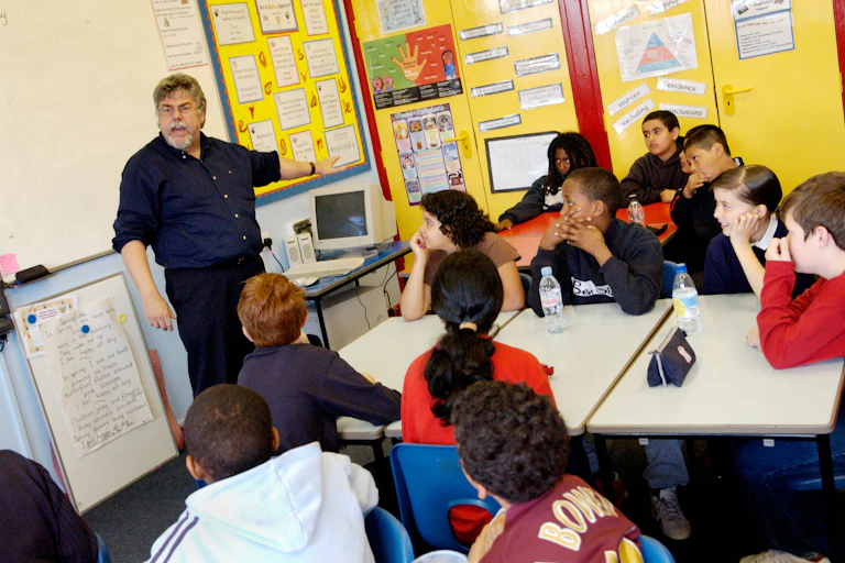 A teacher teaches a creative writing lesson in a primary school classroom